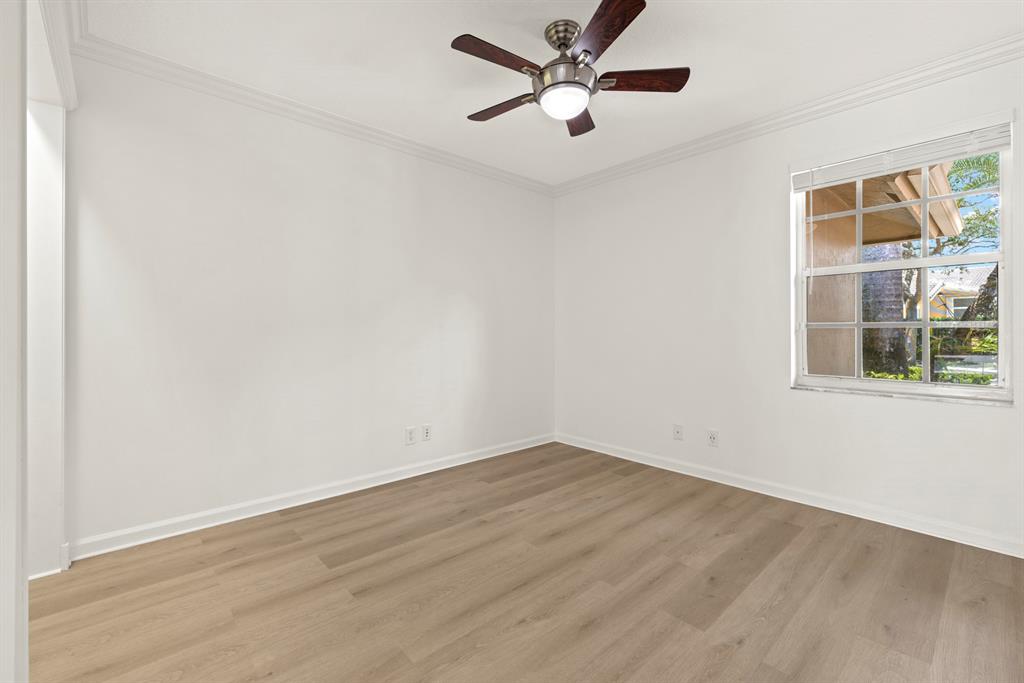 3707 Oak Ridge Circle Weston, FL 33331 - Photo 20 of 47 an empty room with a window and a ceiling fan