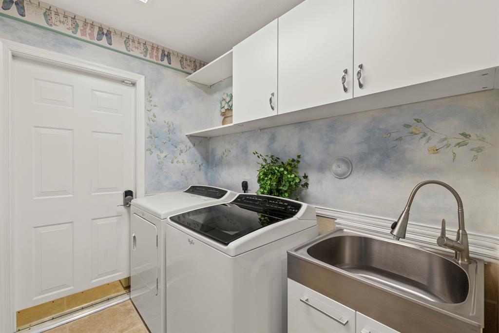 3707 Oak Ridge Circle Weston, FL 33331 - Photo 26 of 47 a kitchen with a sink and cabinets