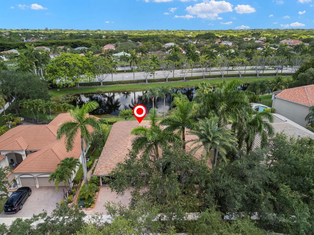 3707 Oak Ridge Circle Weston, FL 33331 - Photo 35 of 47 an aerial view of a house with a yard and lake view