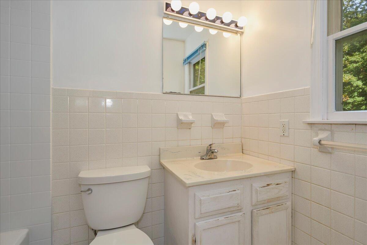 179 Hunting Ridge Road Stamford, CT 06903 - Photo 15 of 24 a bathroom with a toilet sink and mirror