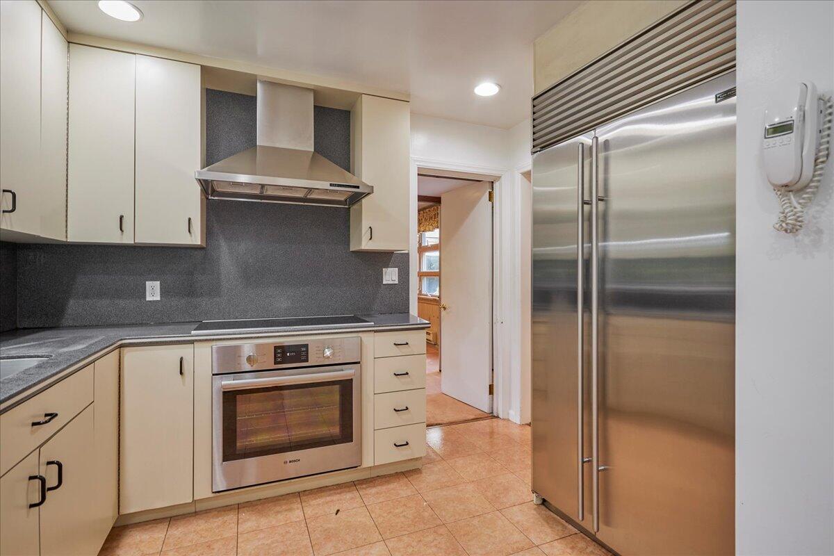 179 Hunting Ridge Road Stamford, CT 06903 - Photo 7 of 24 a kitchen with stainless steel appliances granite countertop a refrigerator and a stove