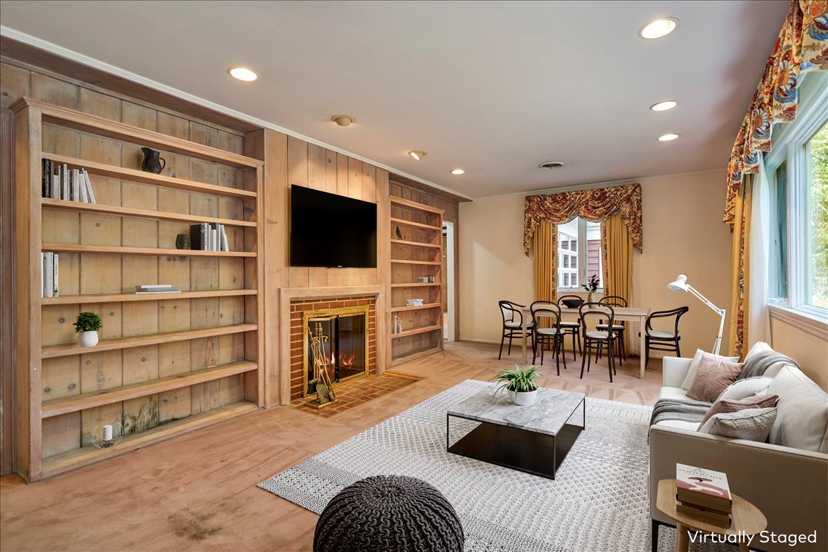 179 Hunting Ridge Road Stamford, CT 06903 - Photo 10 of 24 a living room with furniture and a flat screen tv