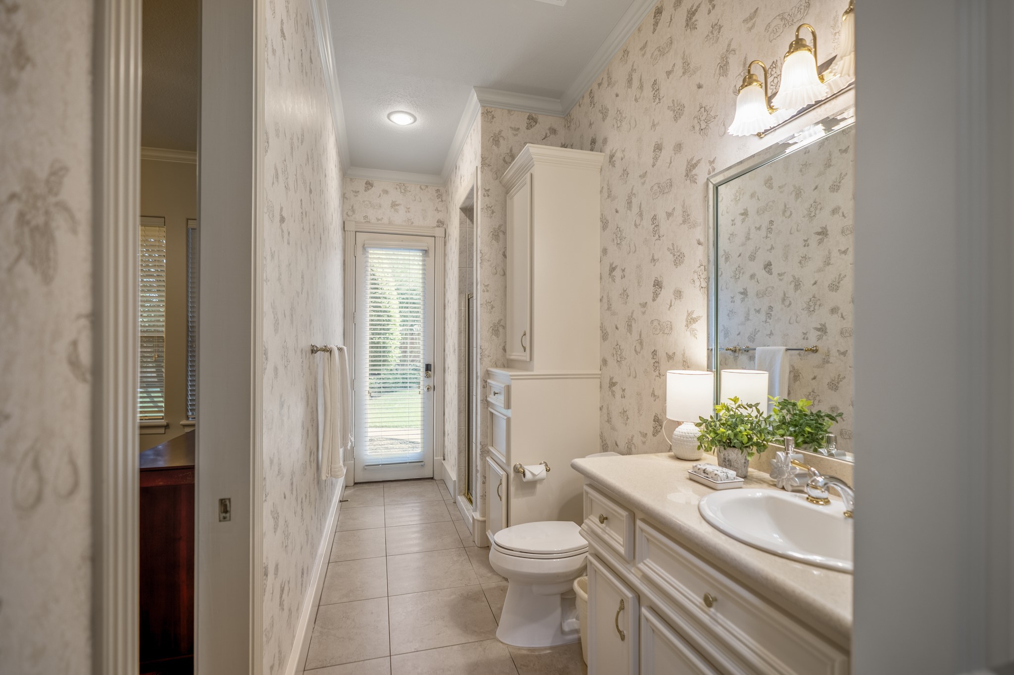 8806 Sterling Gate Circle Spring, TX 77379 - Photo 20 of 40 This full bathroom is adjacent to the second bedroom down and serves as the pool bathroom.