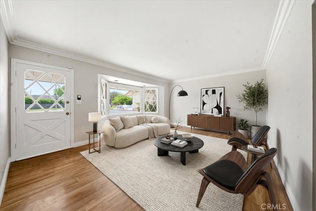 6481 Dos Rios Road Downey, CA 90240 - Photo 2 of 27 a living room with furniture and a window