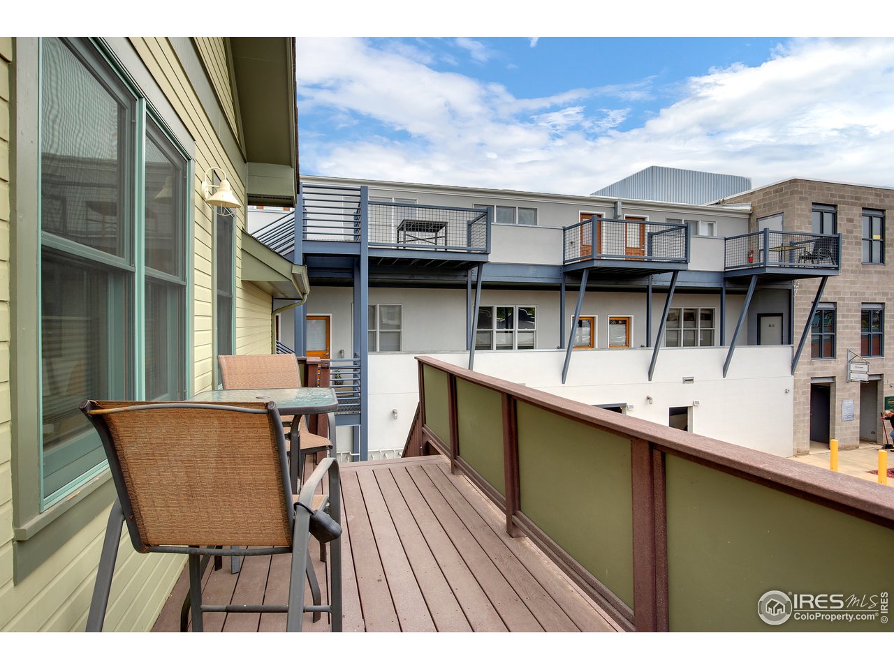 1933 Pearl Street, Unit 7 Boulder, CO 80302 - Photo 11 of 21 a view of a chairs and table in a balcony
