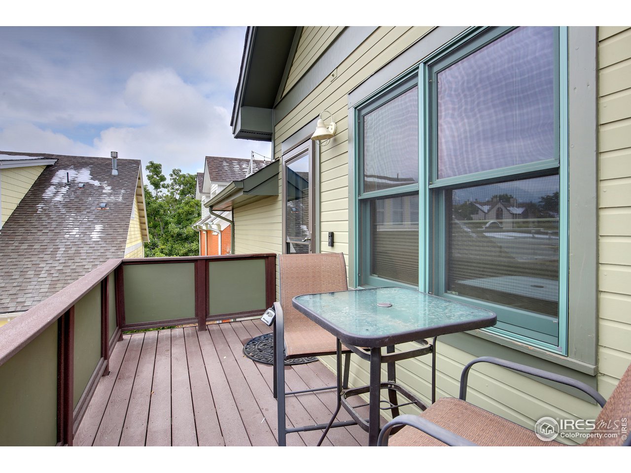 1933 Pearl Street, Unit 7 Boulder, CO 80302 - Photo 13 of 21 a balcony with table and chairs
