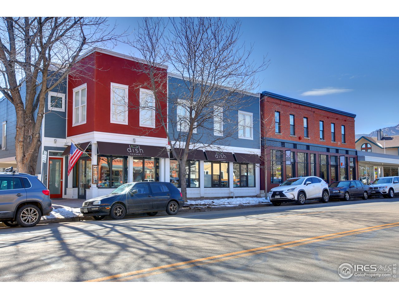 1933 Pearl Street, Unit 7 Boulder, CO 80302 - Photo 18 of 21 a front view of a building with cars parked