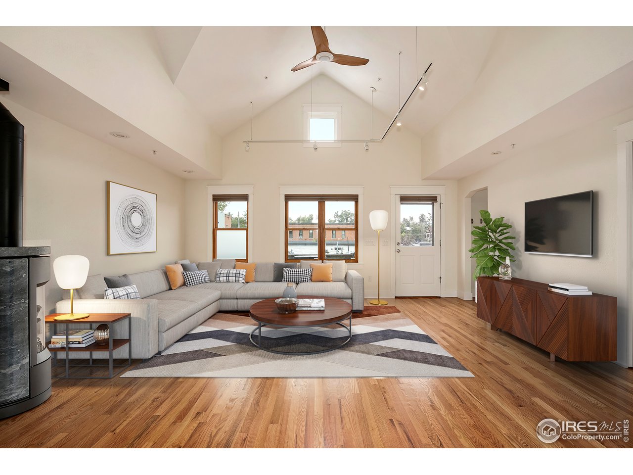1933 Pearl Street, Unit 7 Boulder, CO 80302 - Photo 2 of 21 a living room with furniture and a flat screen tv