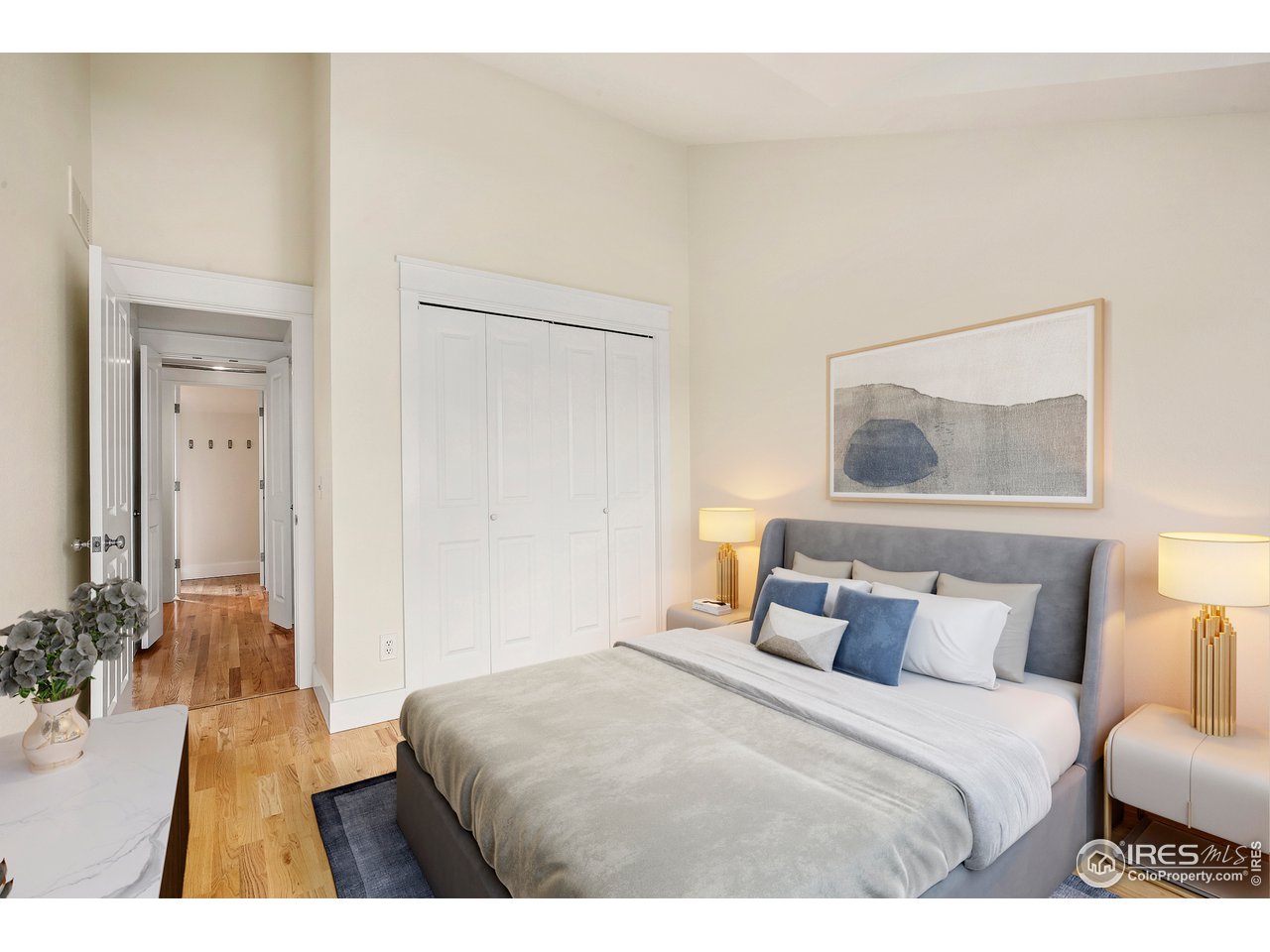 1933 Pearl Street, Unit 7 Boulder, CO 80302 - Photo 7 of 21 a bedroom with a bed and a painting on the wall