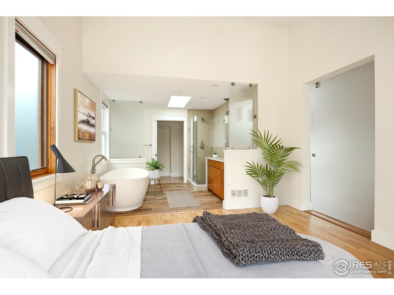1933 Pearl Street, Unit 7 Boulder, CO 80302 - Photo 8 of 21 a living room with a couch and a potted plant