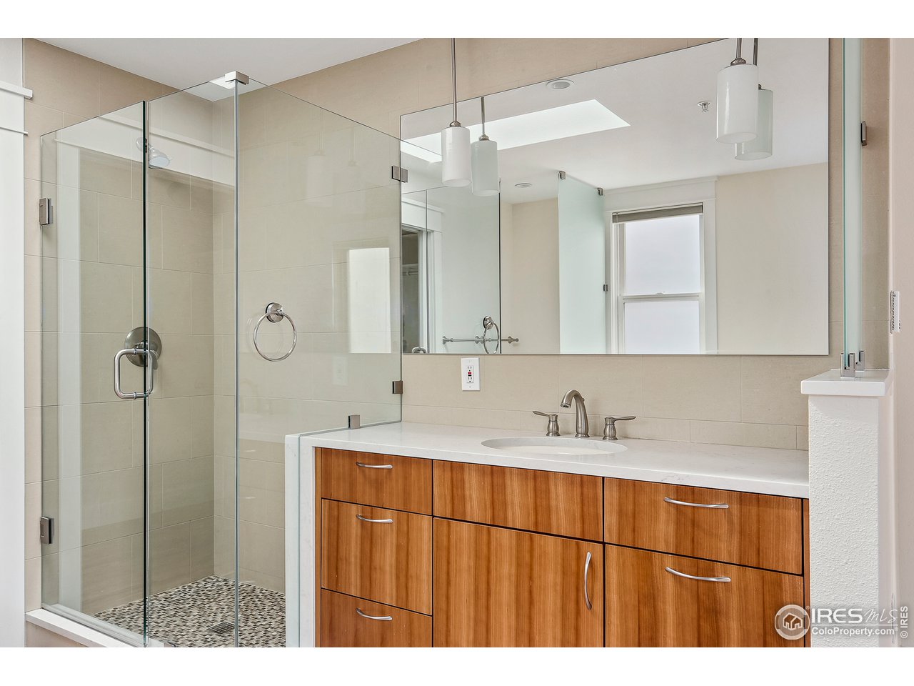 1933 Pearl Street, Unit 7 Boulder, CO 80302 - Photo 10 of 21 a bathroom with a sink and a mirror