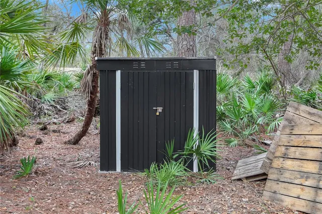a backyard of a house with potted plants