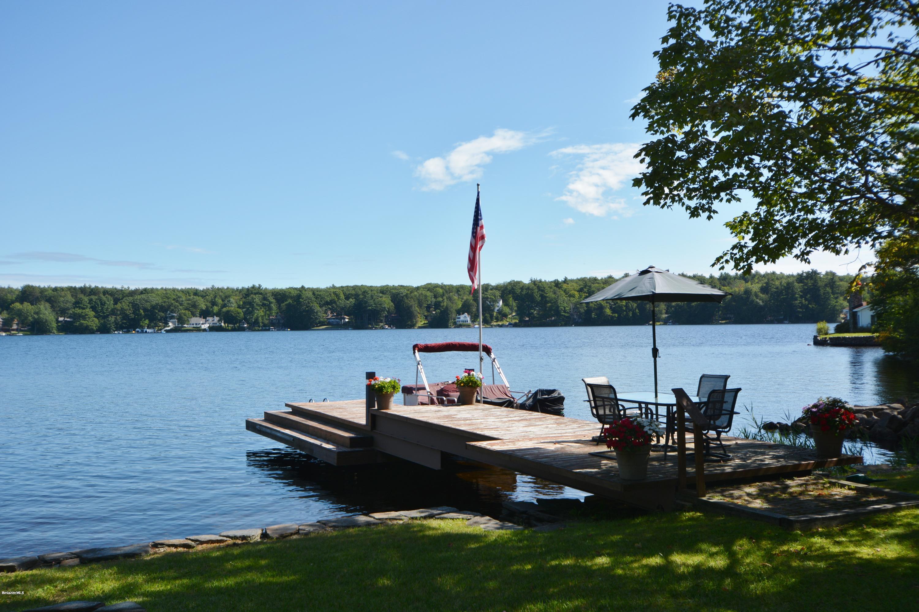 18 Moody Goodman Road Otis, MA 01029 - Photo 2 of 29 a view of a lake with houses in the back