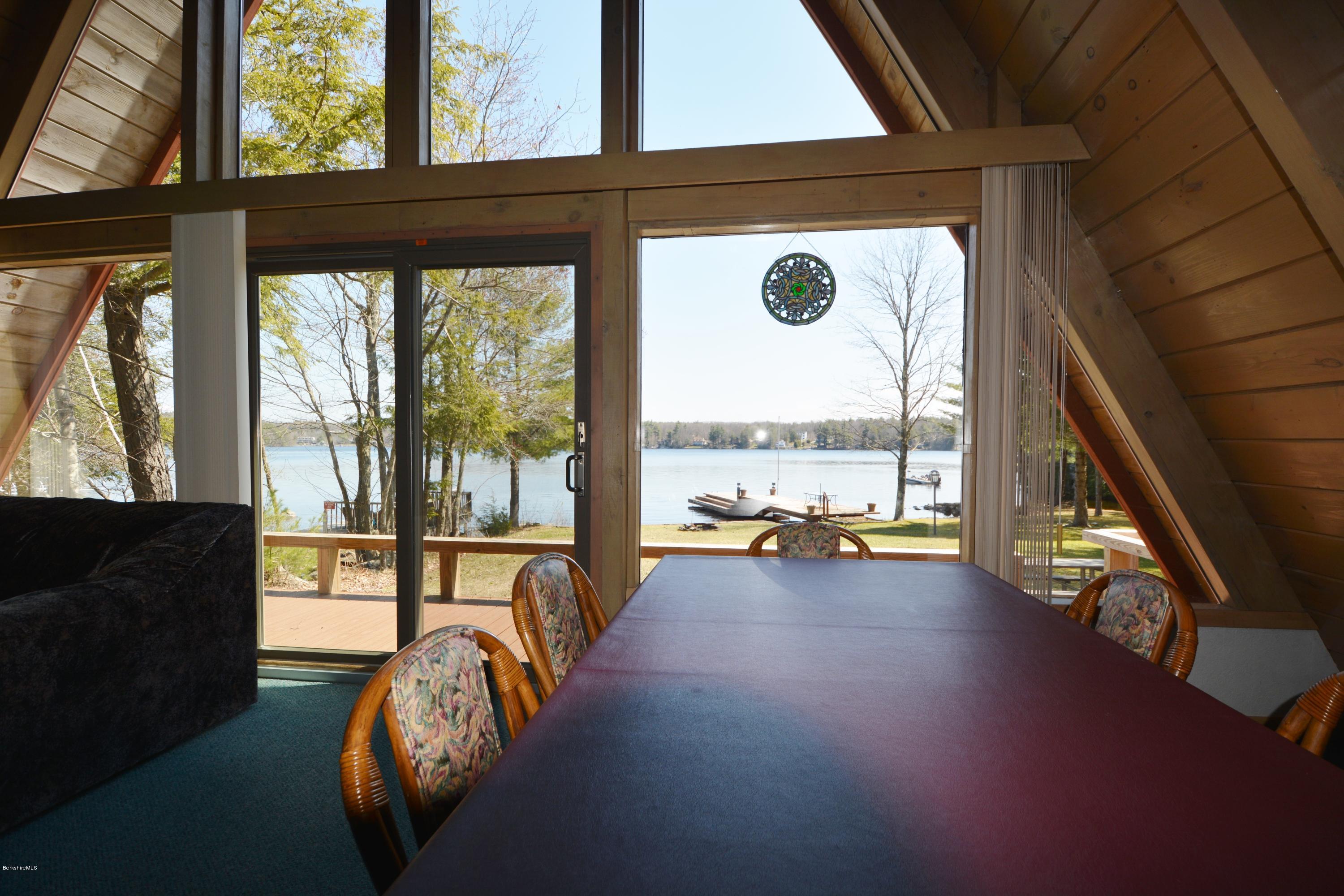 18 Moody Goodman Road Otis, MA 01029 - Photo 17 of 29 a living room with furniture and floor to ceiling windows