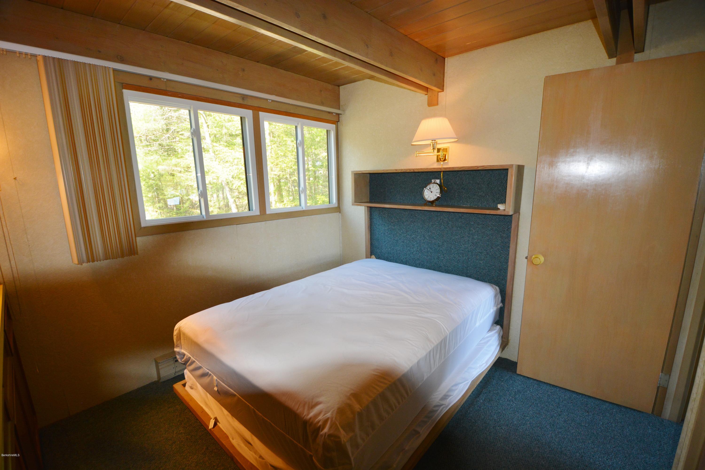 18 Moody Goodman Road Otis, MA 01029 - Photo 20 of 29 a bedroom with a bed and window