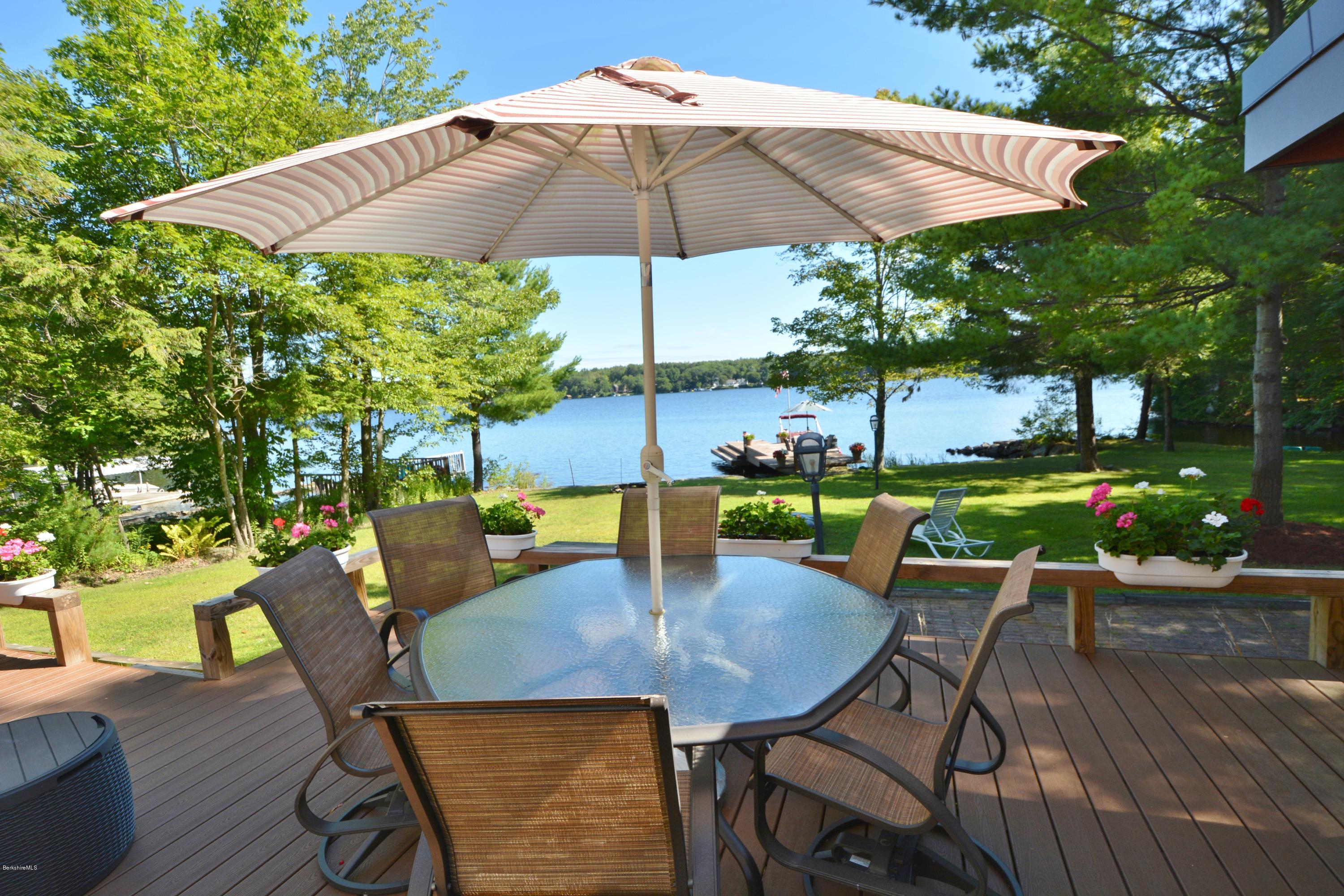 18 Moody Goodman Road Otis, MA 01029 - Photo 23 of 29 a view of an outdoor sitting area with furniture and umbrella