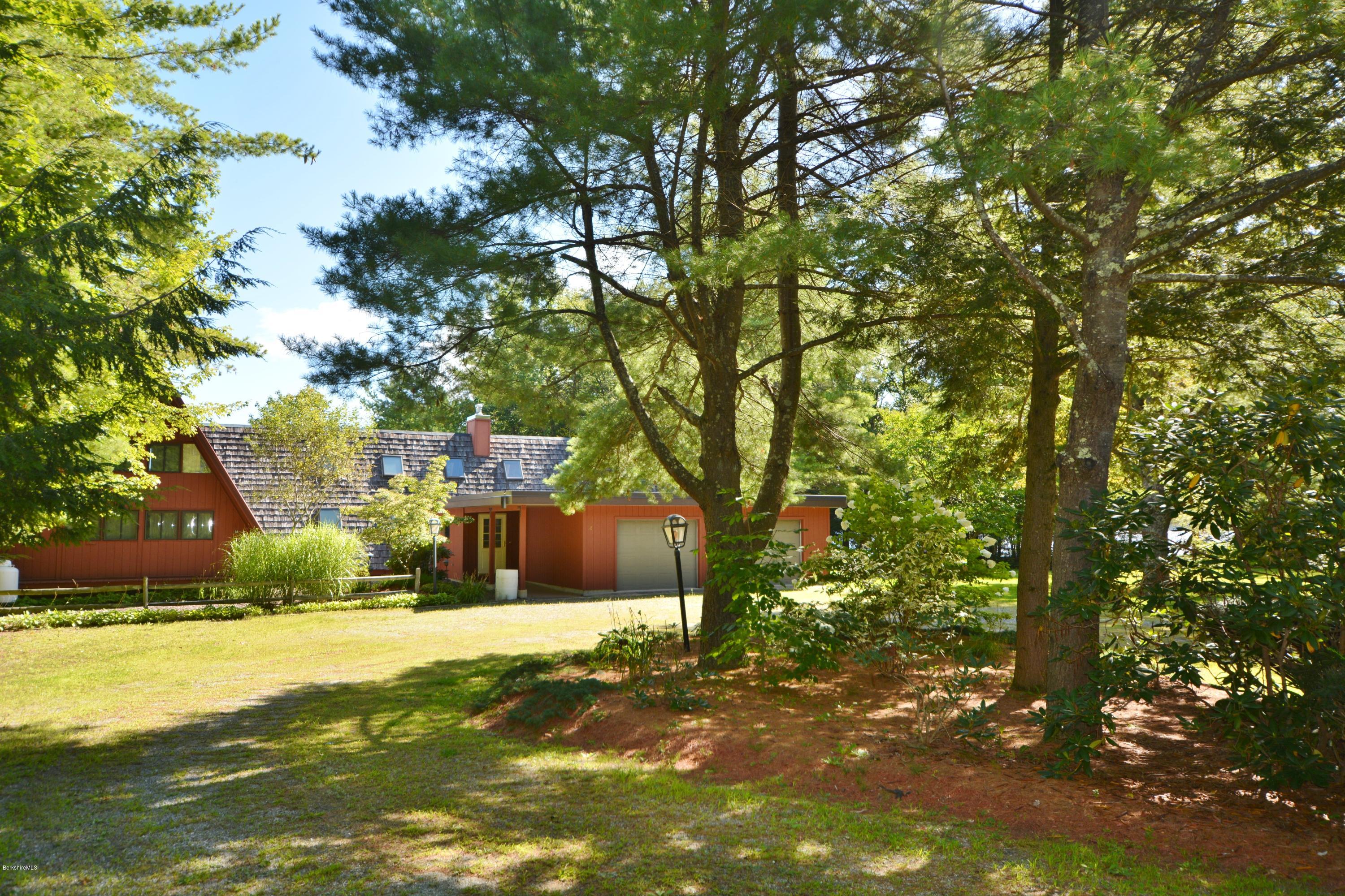 18 Moody Goodman Road Otis, MA 01029 - Photo 27 of 29 a street view with large trees