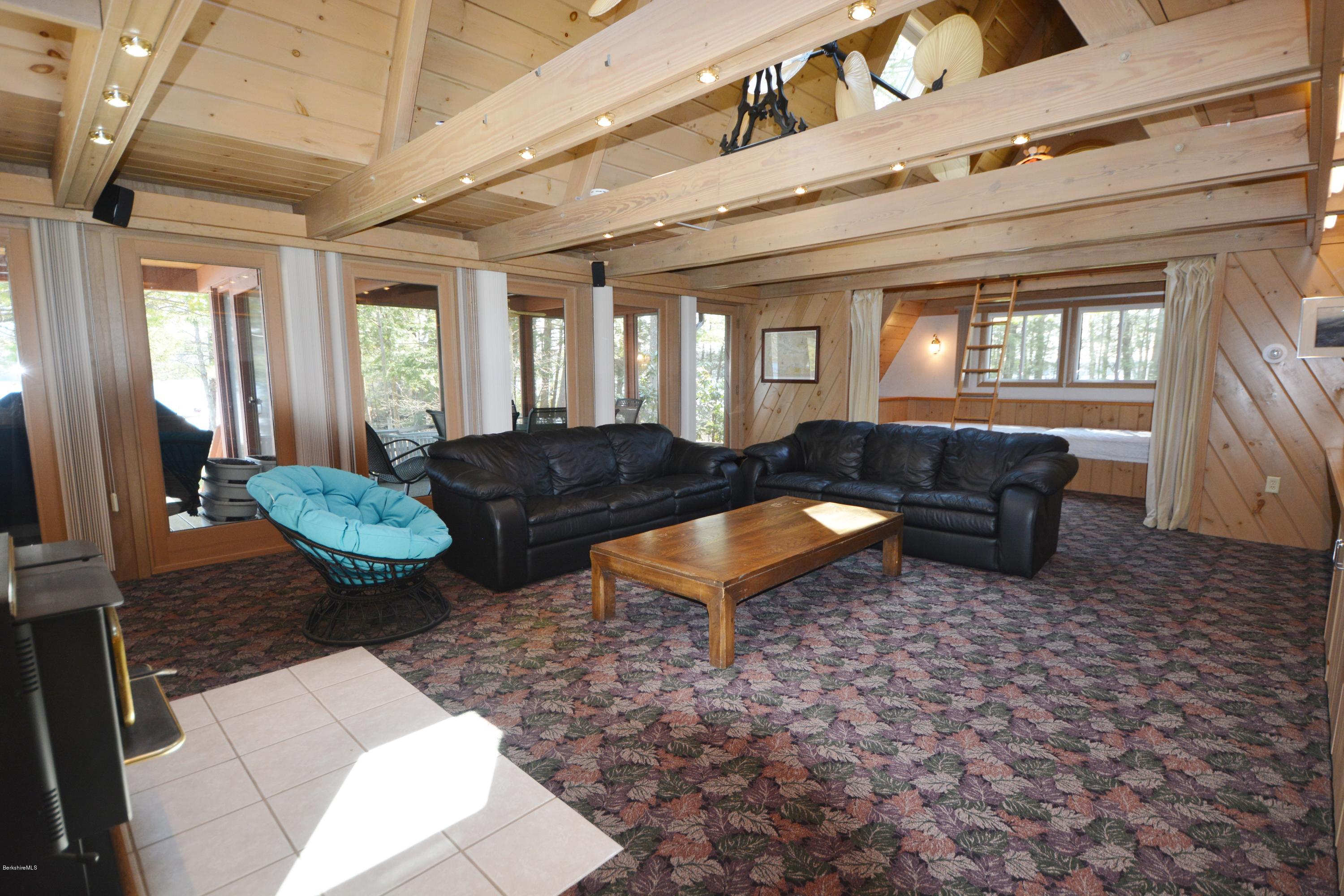 18 Moody Goodman Road Otis, MA 01029 - Photo 8 of 29 a living room with furniture and a fireplace