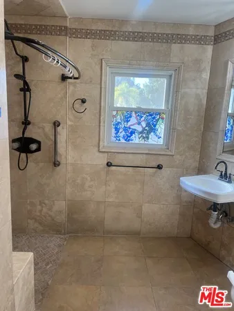 a bathroom with a sink and mirror