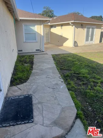 a view of a back yard of the house