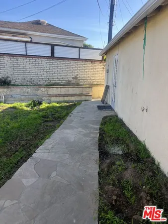 a view of a backyard of the house