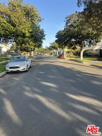 a view of swimming pool with outdoor seating and city view