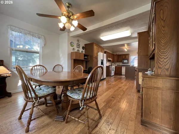 a view of a dining room with furniture and chandelier