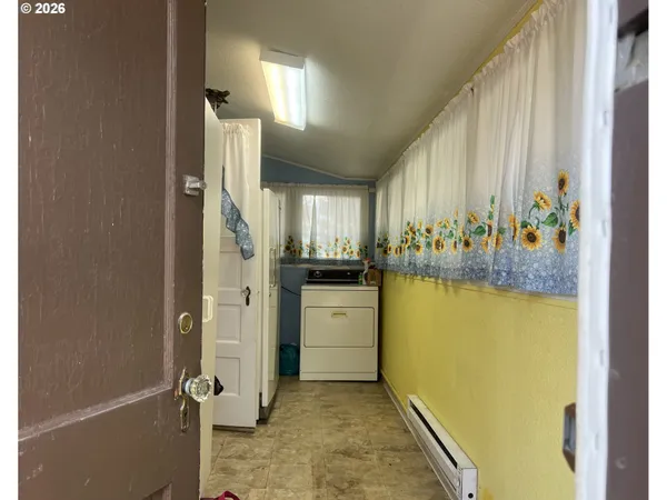 a view of an entryway and livingroom