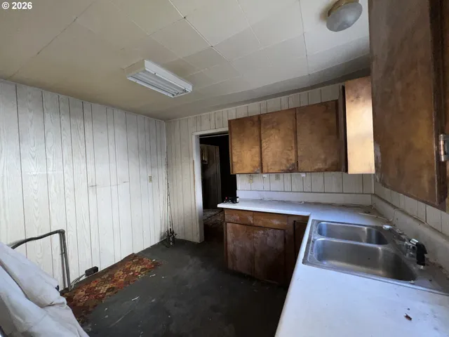 a view of a hallway with seating area