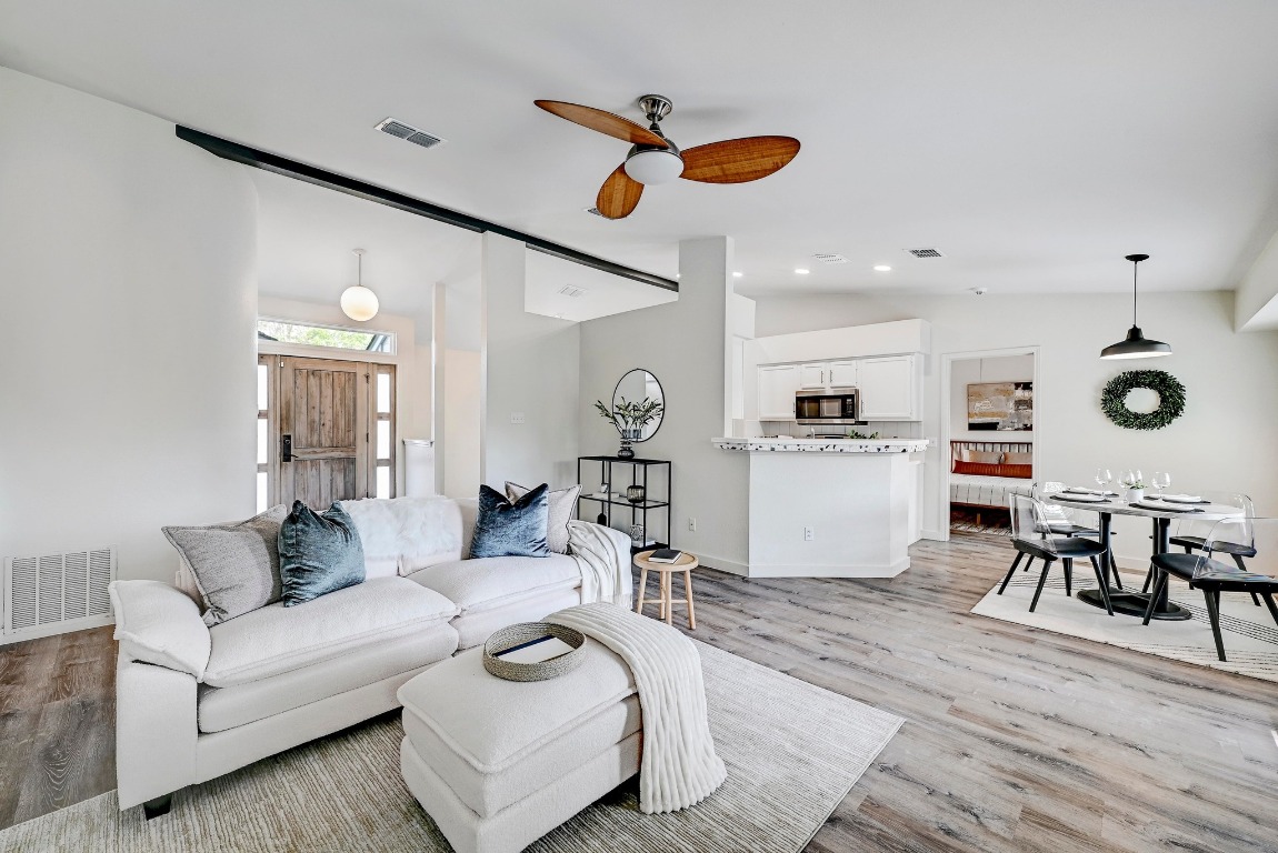4501 Galapagos Drive Austin, TX 78749 - Photo 1 of 28 a living room with furniture kitchen view and a wooden floor