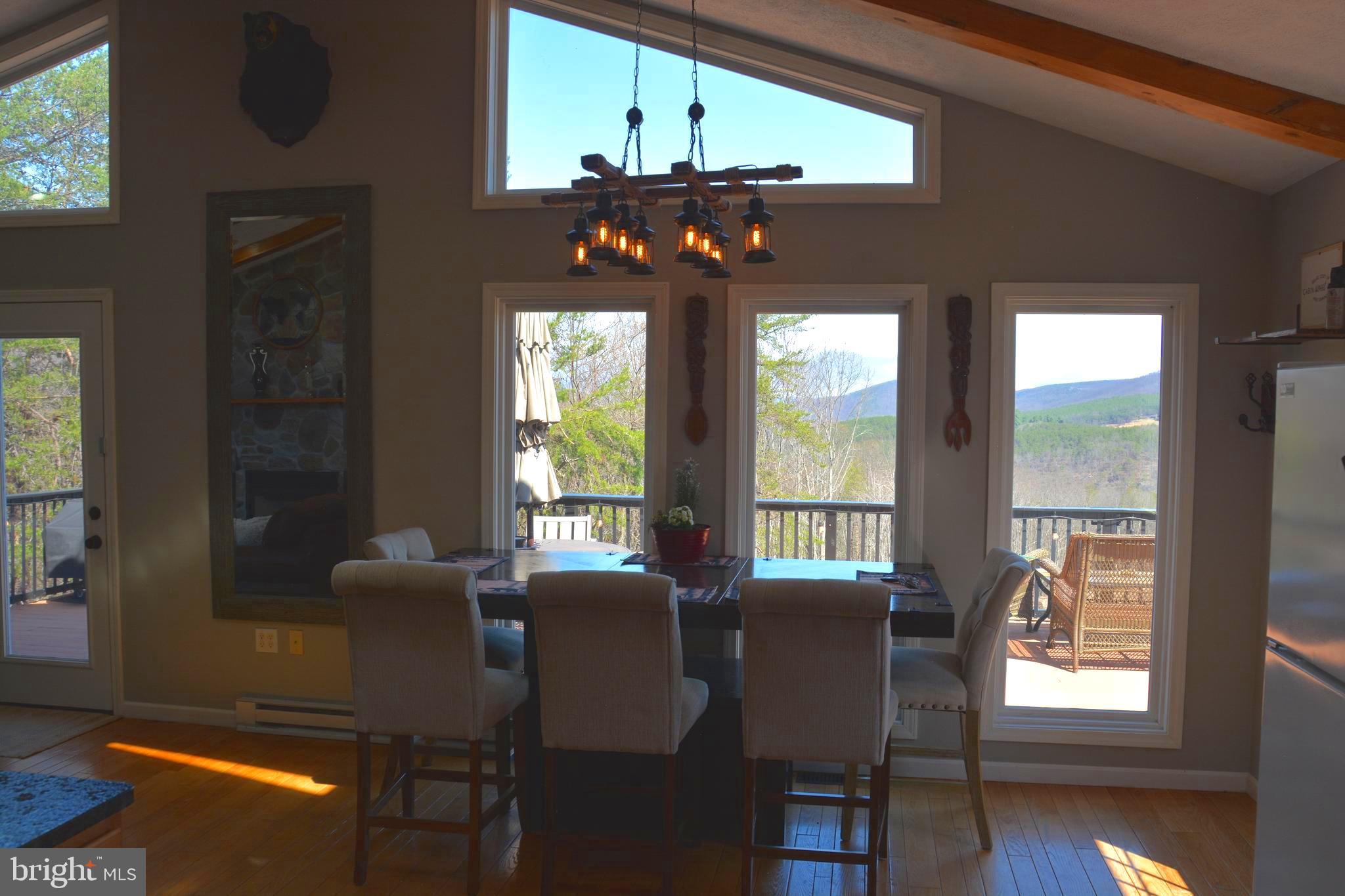 400 Locust Ridge Moorefield, WV 26836 - Photo 15 of 87 a view of a dining room with furniture window and wooden floor