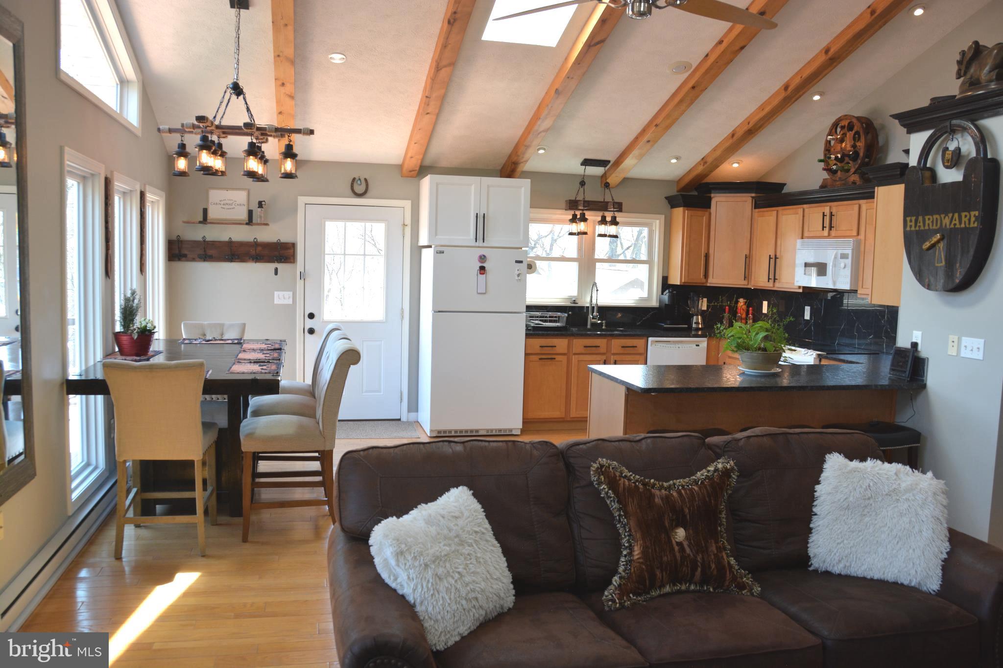 400 Locust Ridge Moorefield, WV 26836 - Photo 20 of 87 a dining room with furniture a chandelier and wooden floor