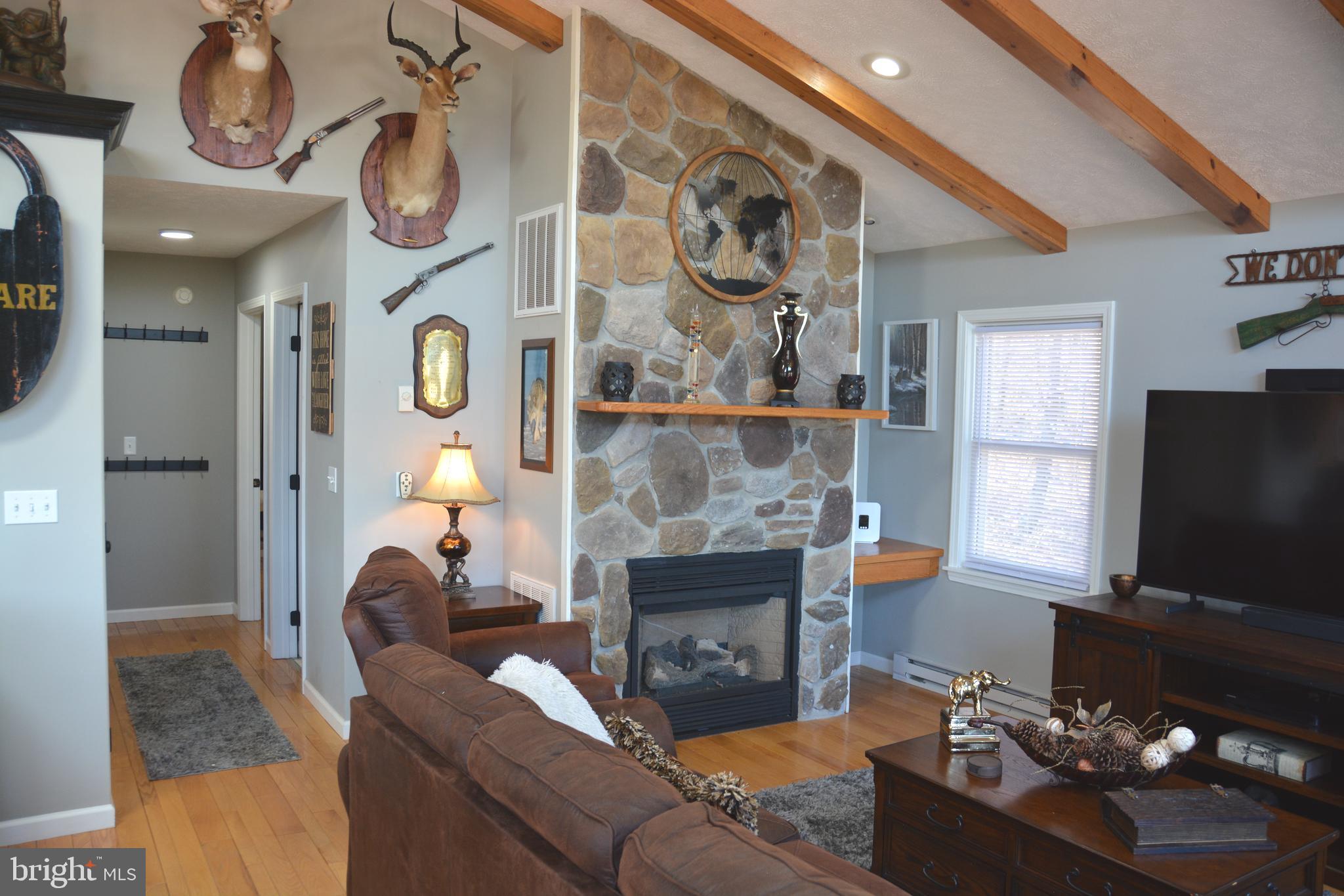 400 Locust Ridge Moorefield, WV 26836 - Photo 26 of 87 a living room with fireplace furniture and a flat screen tv