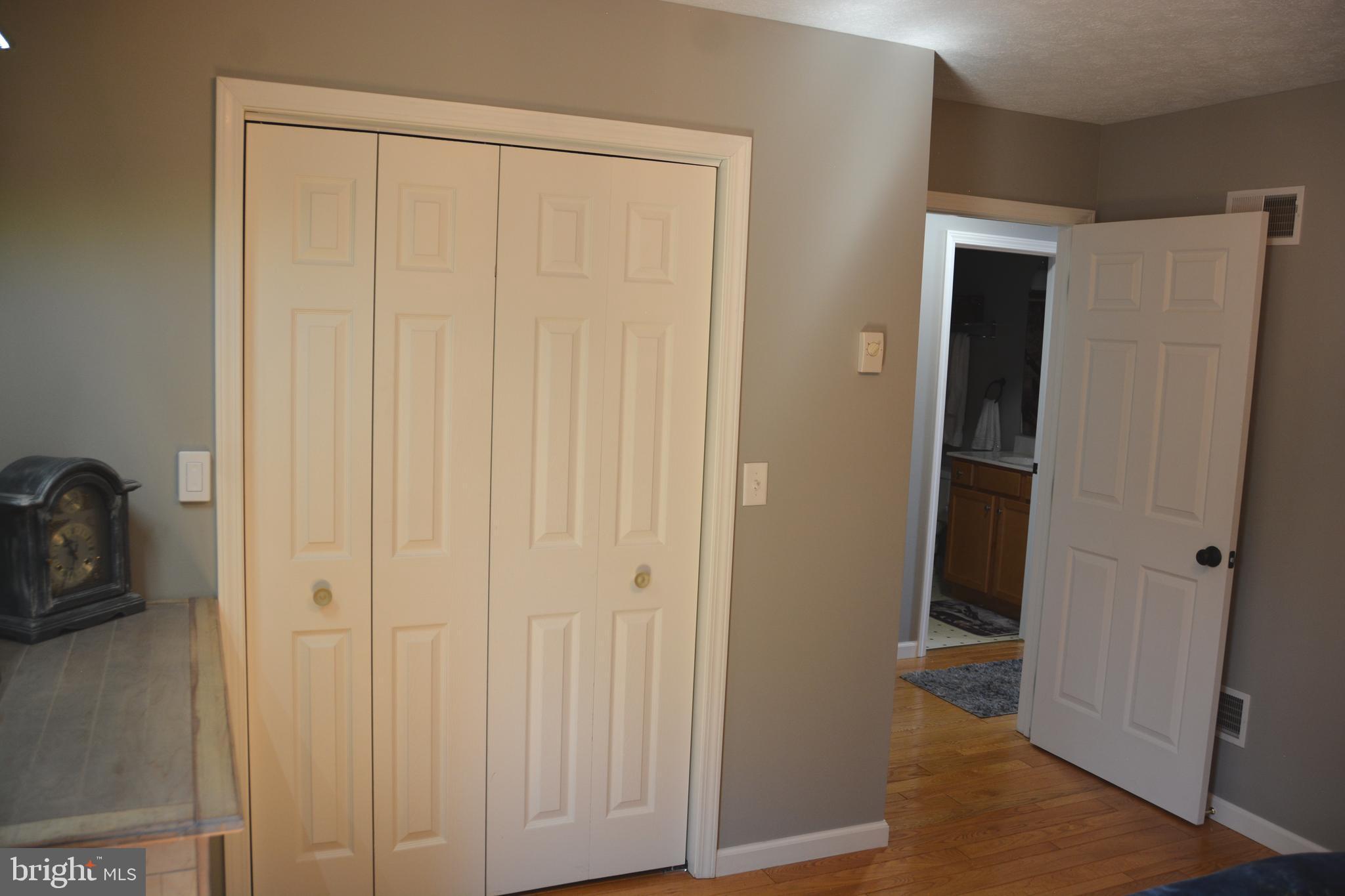 400 Locust Ridge Moorefield, WV 26836 - Photo 32 of 87 a view of a closet area with a wooden door