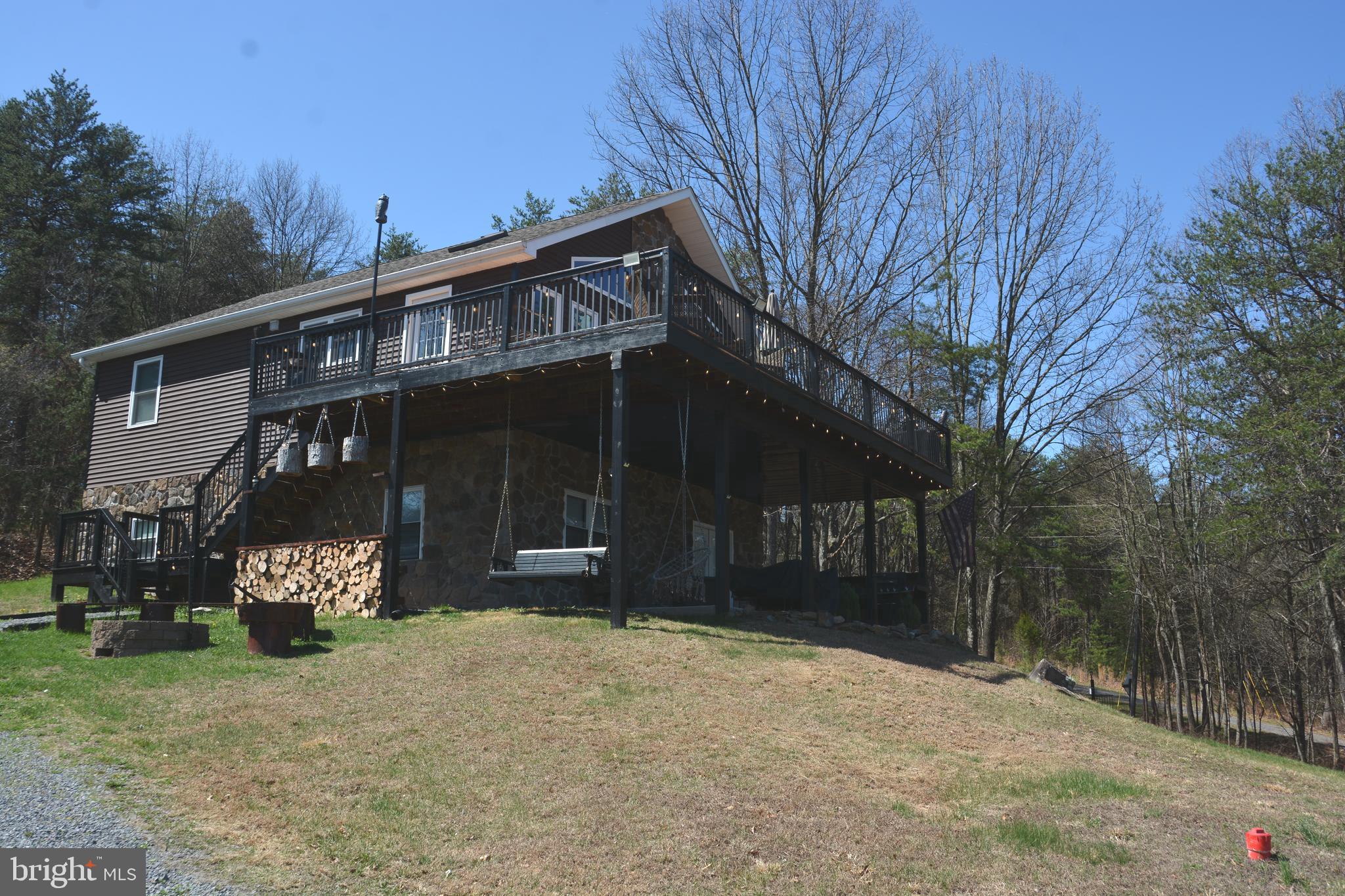 400 Locust Ridge Moorefield, WV 26836 - Photo 5 of 87 a front view of a house with a yard and garage