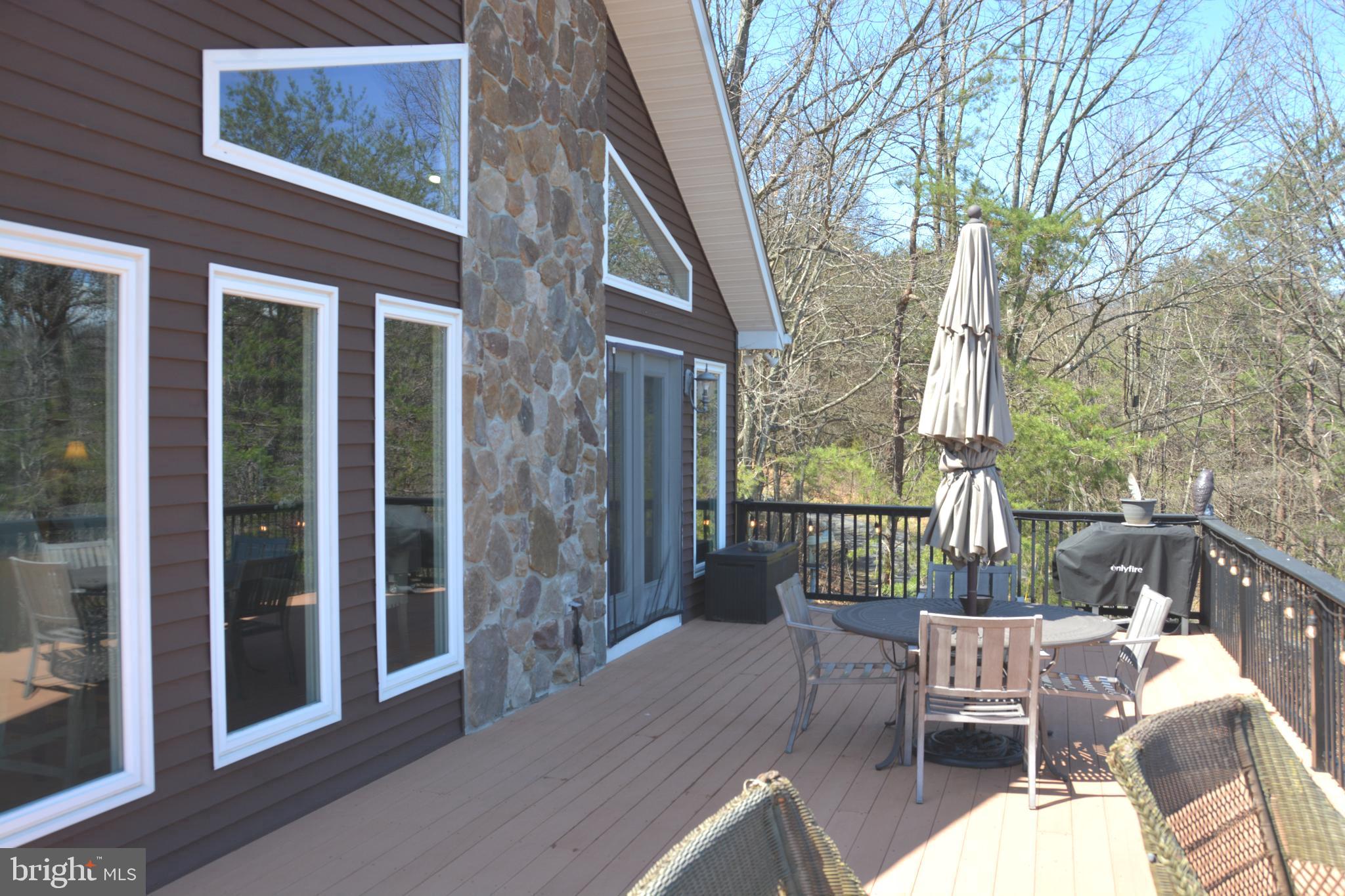 400 Locust Ridge Moorefield, WV 26836 - Photo 59 of 87 a view of a patio with a chairs and table in a patio