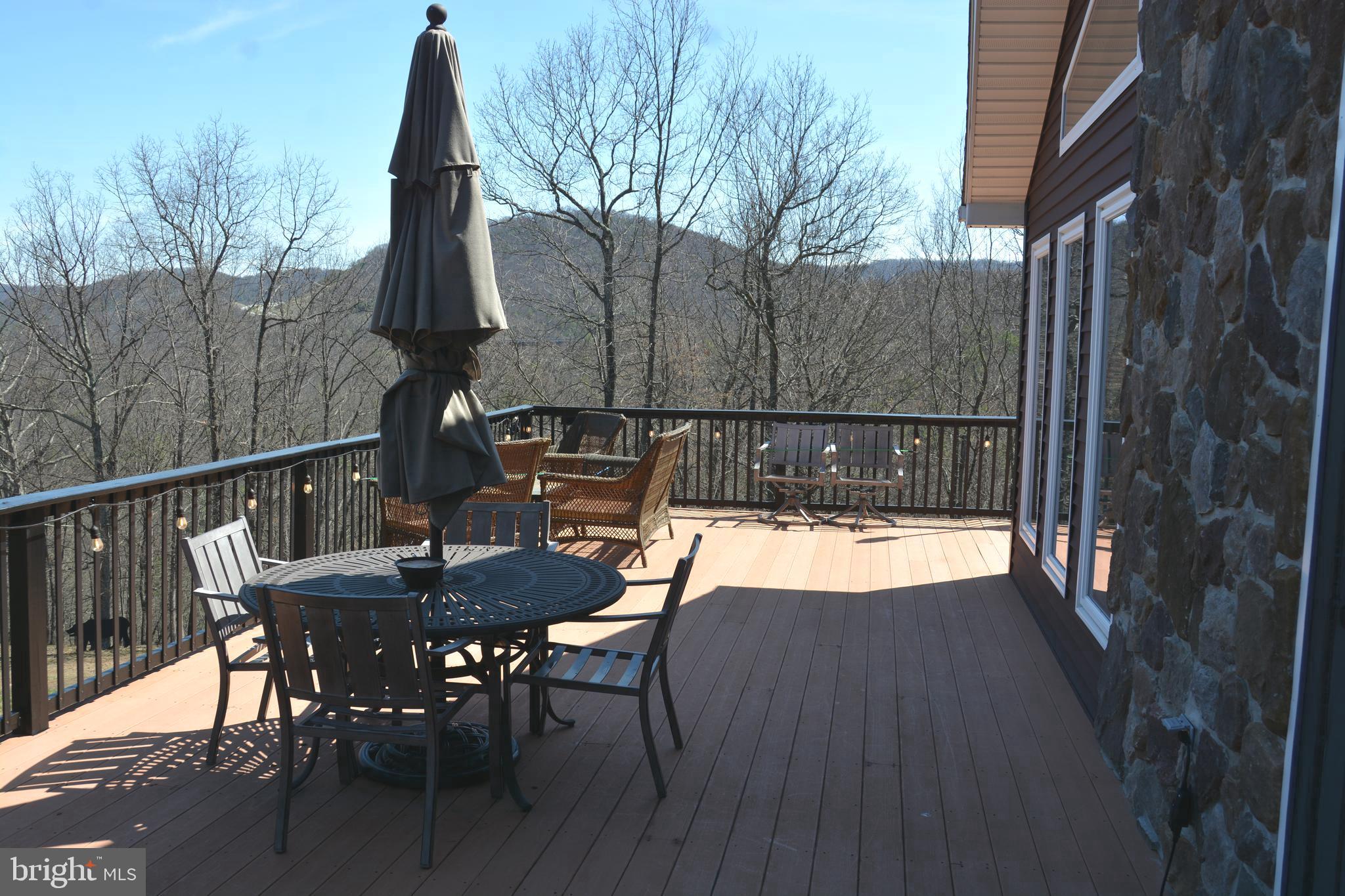 400 Locust Ridge Moorefield, WV 26836 - Photo 62 of 87 a view of backyard with furniture and wooden deck