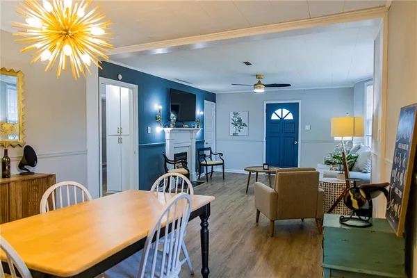 a view of a dining room with furniture and wooden floor