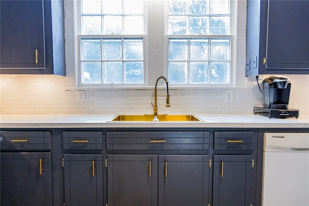 27 Oak Street Northeast Rome, GA 30161 - Photo 17 of 27 a view of kitchen with sink microwave and cabinets