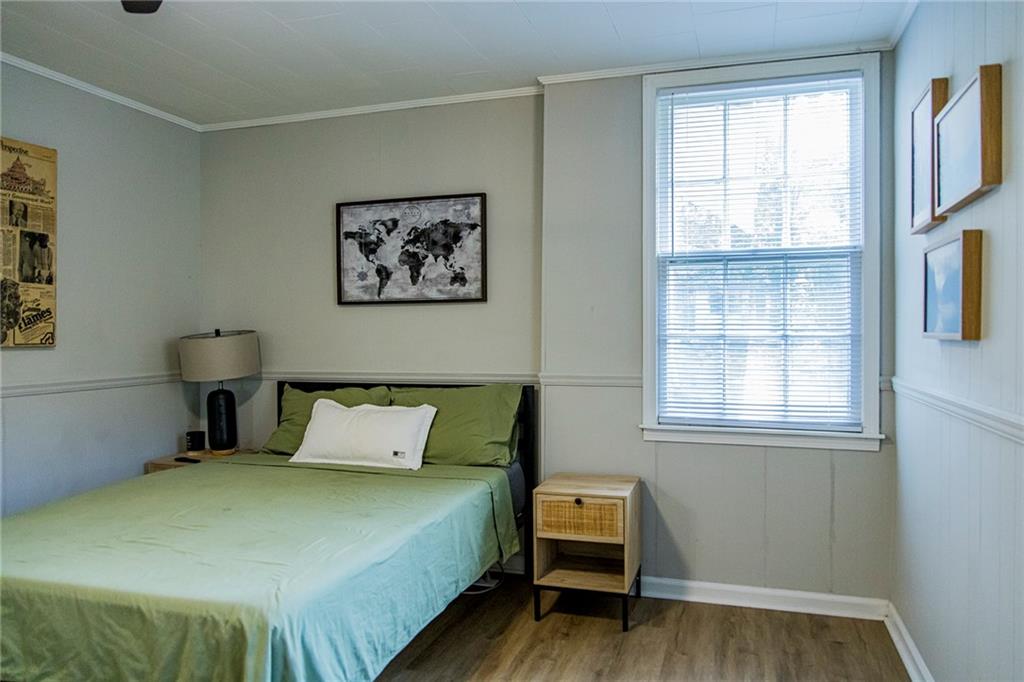 27 Oak Street Northeast Rome, GA 30161 - Photo 20 of 27 a bedroom with a bed and wooden floor