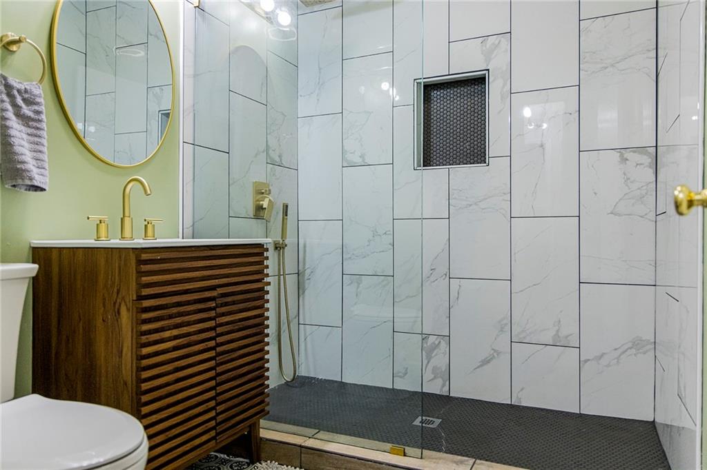 27 Oak Street Northeast Rome, GA 30161 - Photo 26 of 27 a bathroom with a sink a toilet and shower