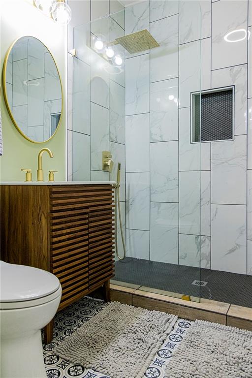 27 Oak Street Northeast Rome, GA 30161 - Photo 27 of 27 a bathroom with a sink a toilet and a mirror