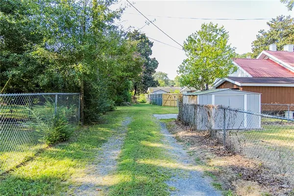 a view of a backyard with a small cabin