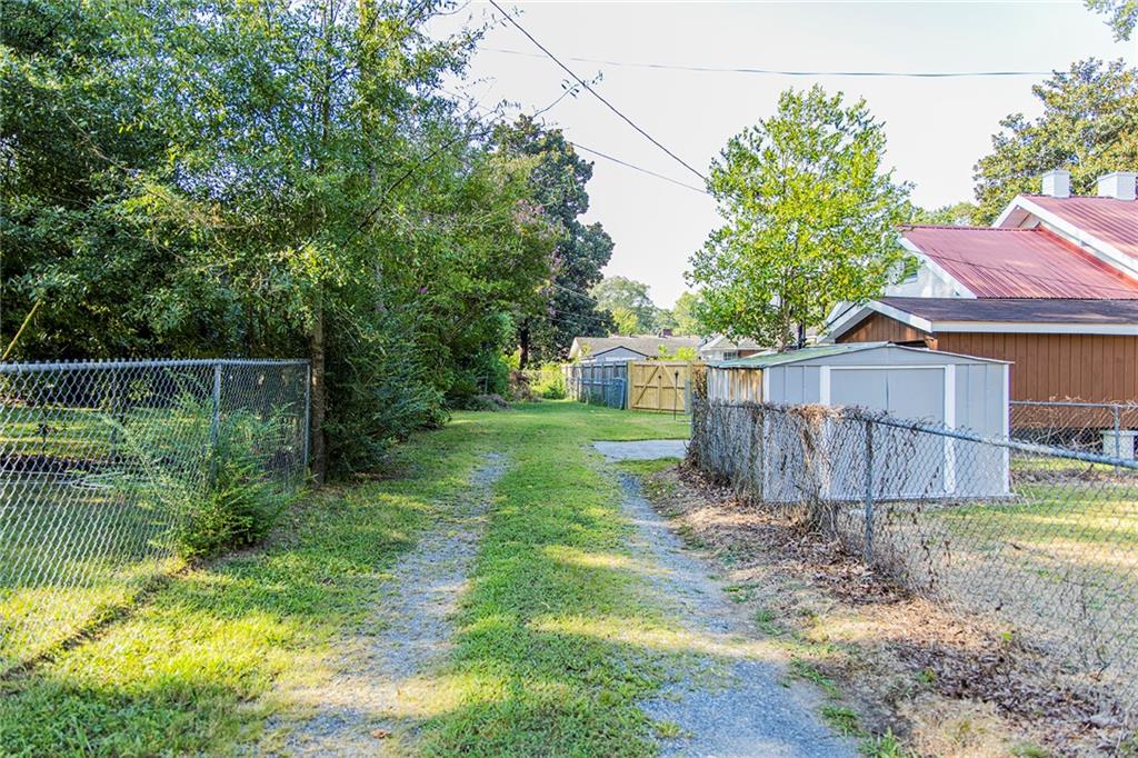 27 Oak Street Northeast Rome, GA 30161 - Photo 3 of 27 a view of a backyard with a small cabin