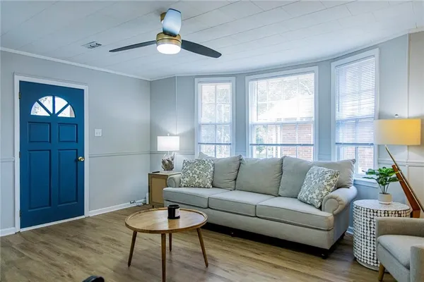 a living room with furniture and a window