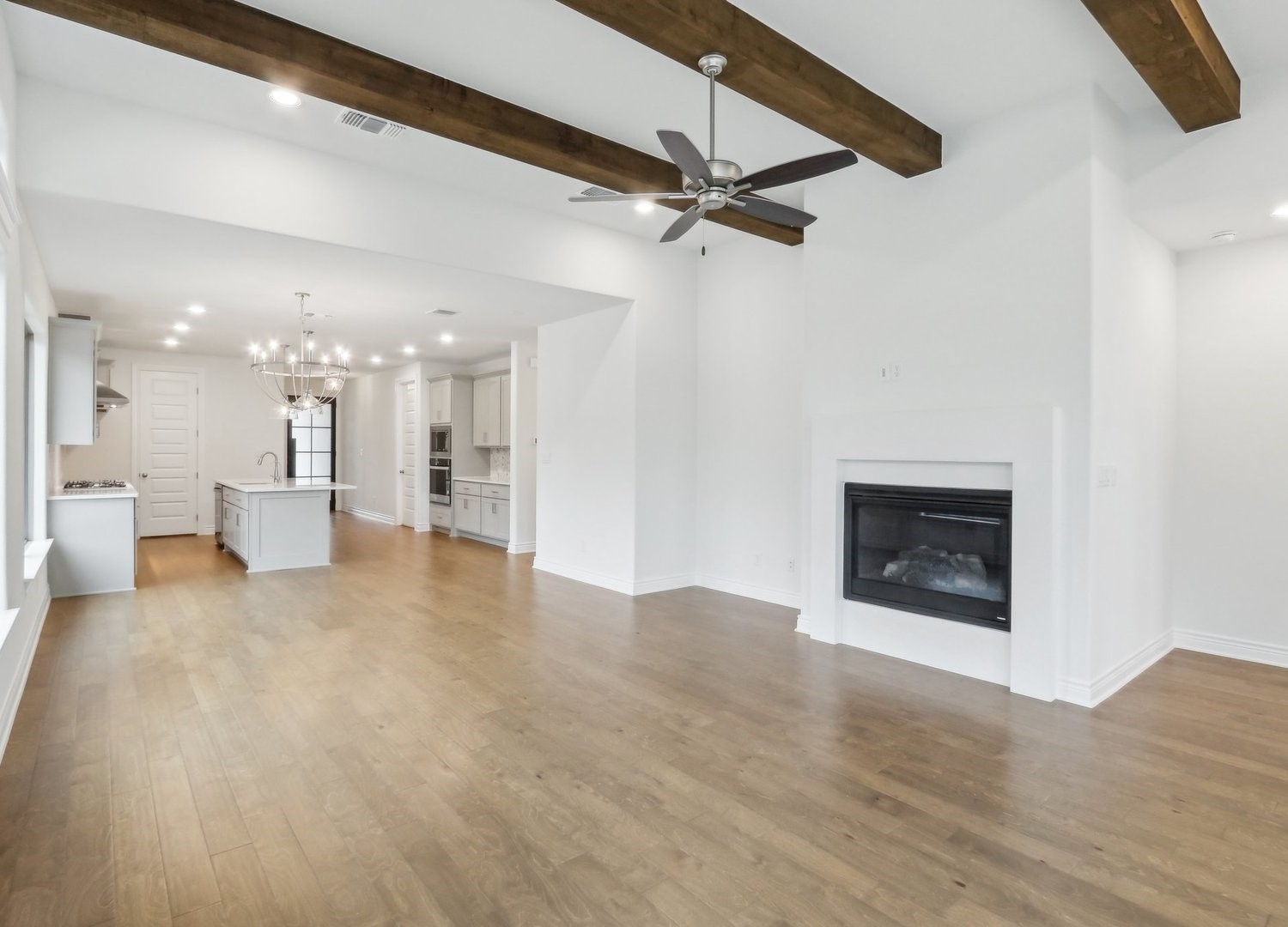 1129 Stonehill Drive Georgetown, TX 78633 - Photo 5 of 26 a view of a livingroom with a fireplace and a ceiling fan