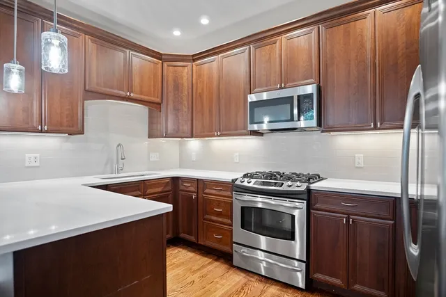a kitchen with a stove and a microwave
