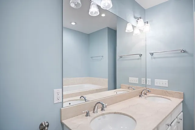 a bathroom with a bathtub and a shower