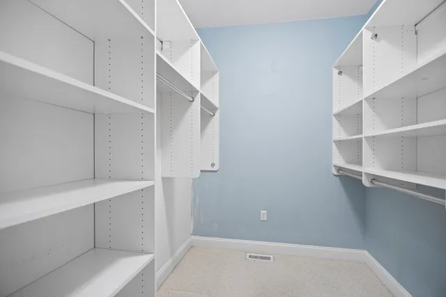 a bathroom with a sink vanity granite and toilet