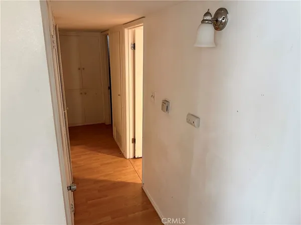 a view of a bathroom from a hallway